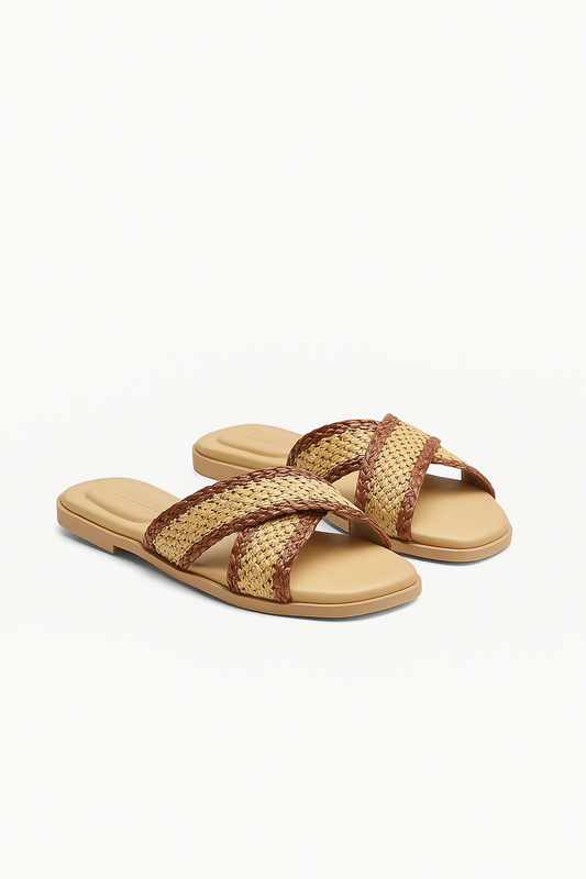 Pair of beige sandals with woven brown straps on a white background